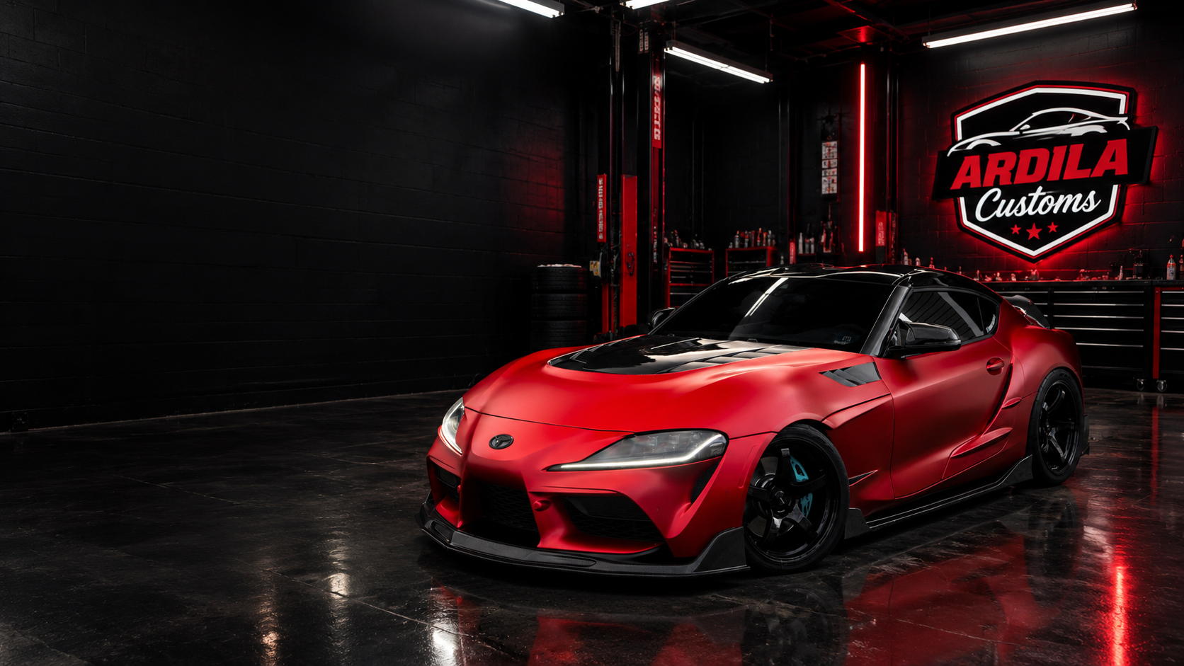 Red Toyota Supra in the Ardila Customs workshop